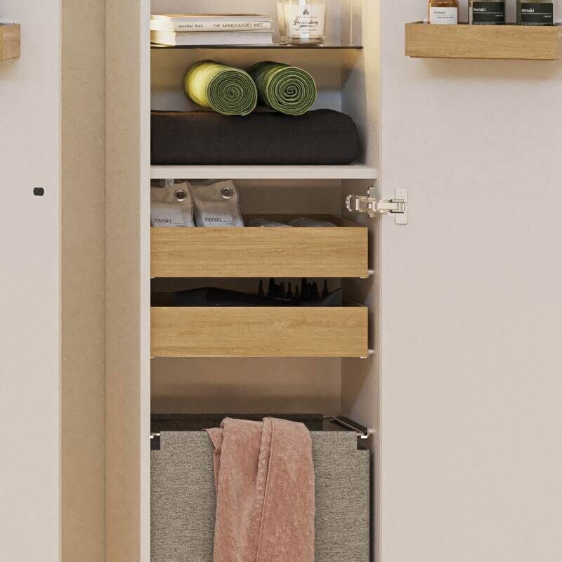 Large bathroom in green colors with vanity unit, brass framed oval mirror and beautiful framed doors