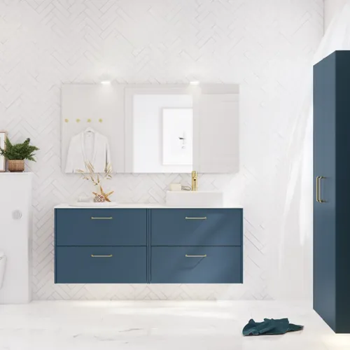 Bathroom inspiration with bathroom furniture in modern blue colour, elegant countertop basin and large square mirror with light, white herringbone tiles create a stylish and classic look