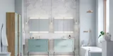 Large bathroom inspiration with light blue bathroom furniture with light wood sides, elegant mirror cabinets, minimalist black legs and handles, double bathroom set, and large white marble tiles create a classic, modern, and symmetrical look
