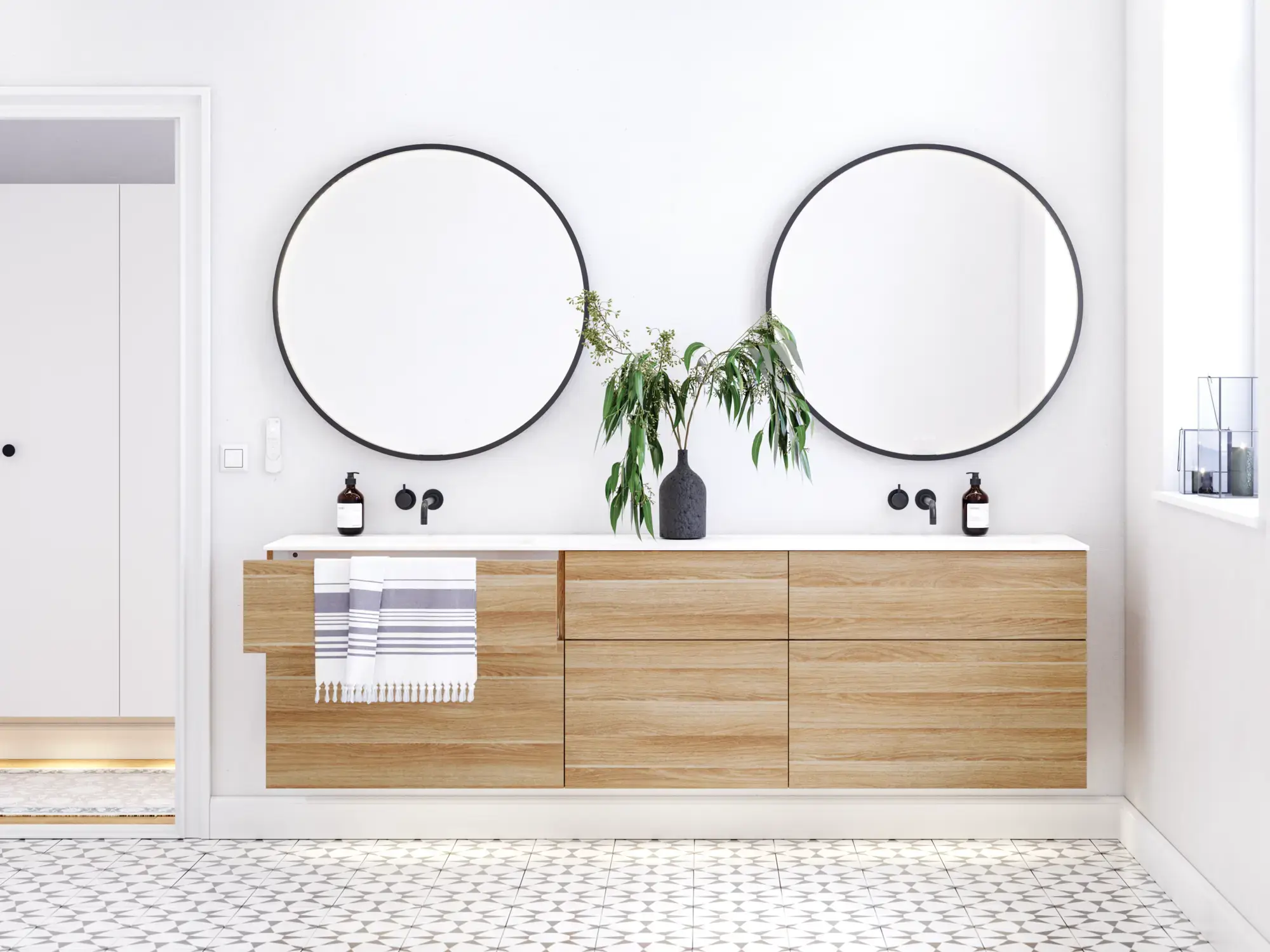 Nordic bathroom in wood finish with beautiful black framed round mirrors and plenty of storage in the furniture