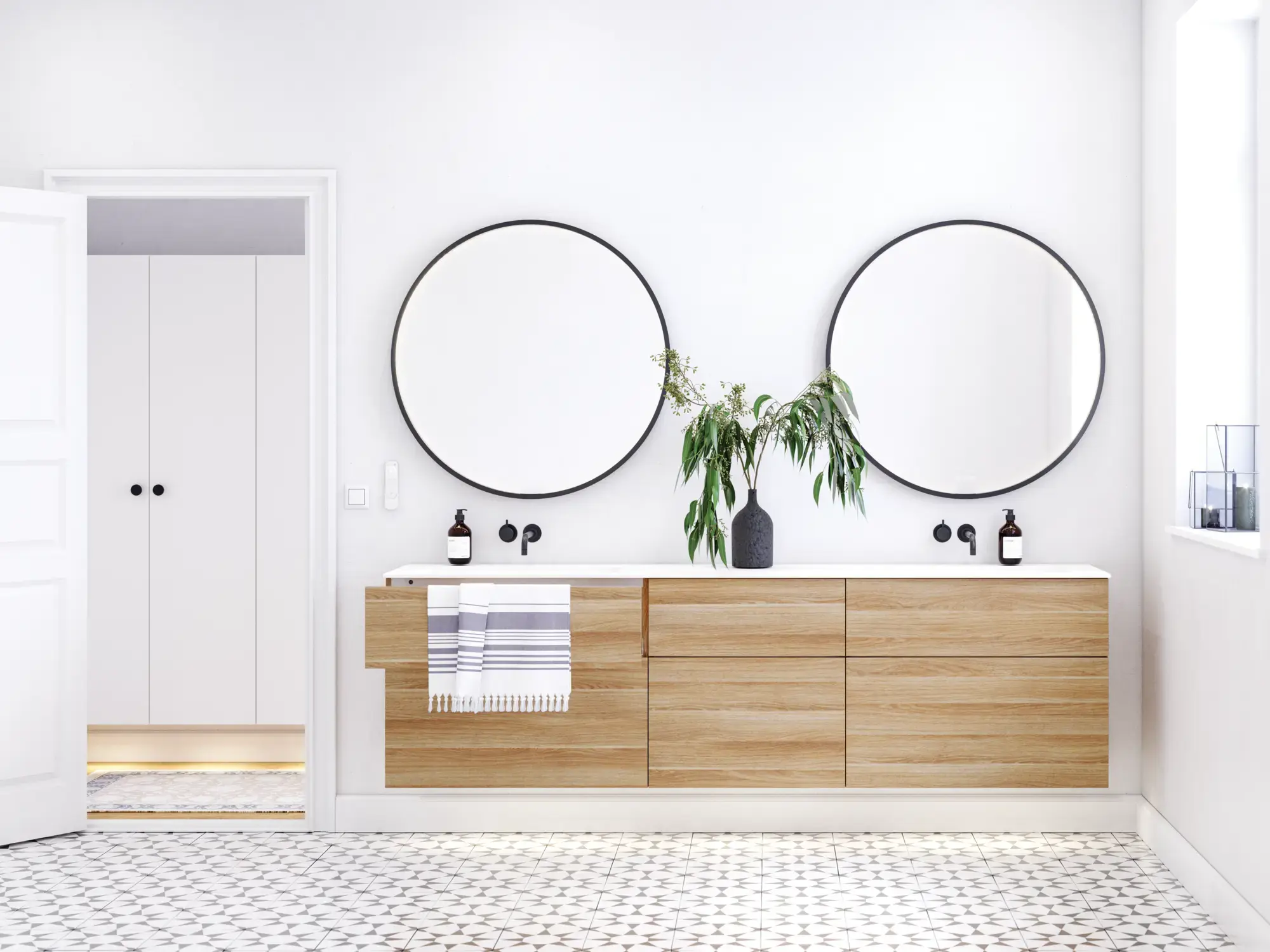 Nordic bathroom in wood finish with beautiful black framed round mirrors and plenty of storage in the furniture