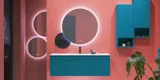 Large bathroom inspiration with blue special color grooved furniture, thin elegant sink, and beautiful round mirrors, red walls, and terrazzo floor create a strong contrast to the furniture, giving a stylish and urban look.