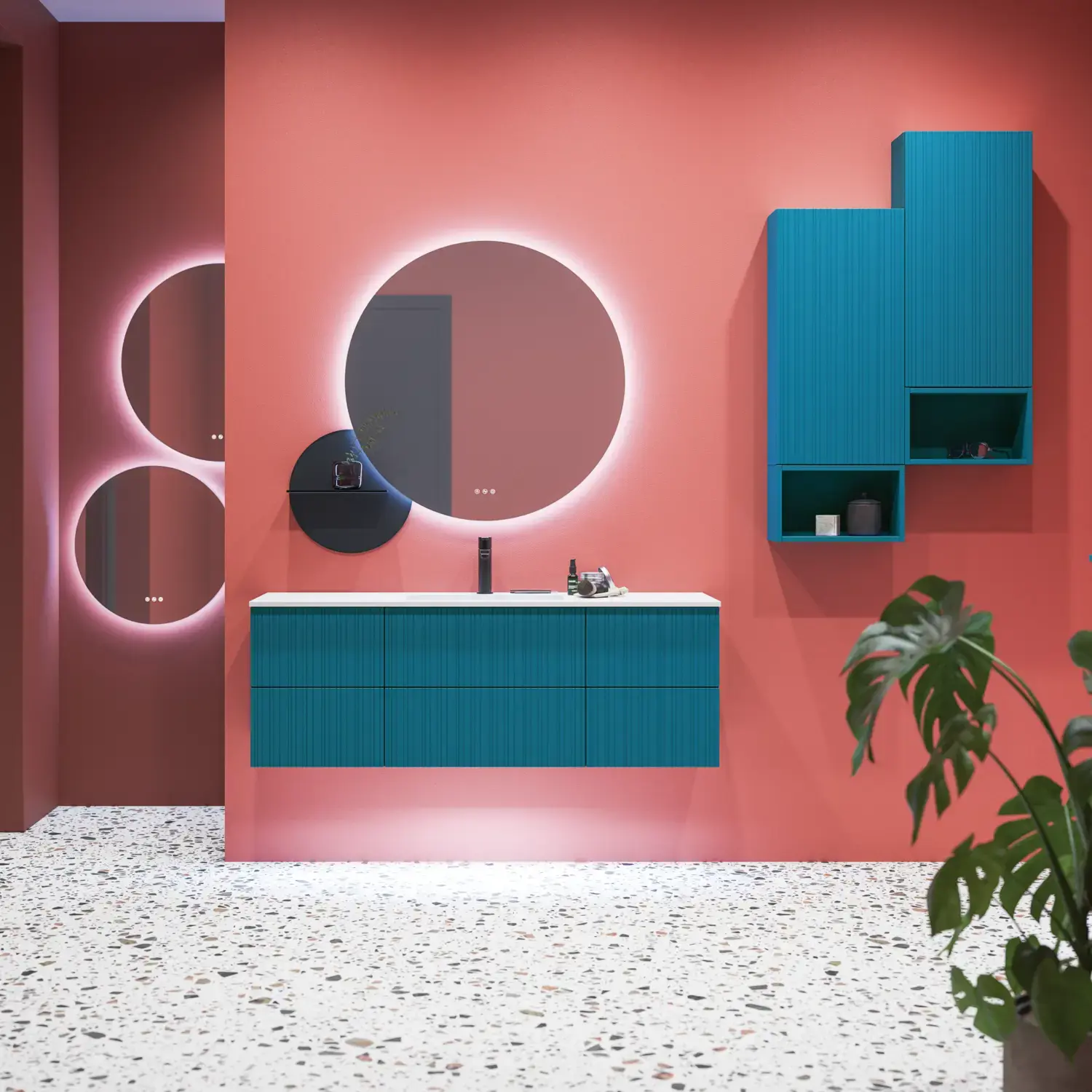Large bathroom inspiration with blue special color grooved furniture, thin elegant sink, and beautiful round mirrors, red walls, and terrazzo floor create a strong contrast to the furniture, giving a stylish and urban look.