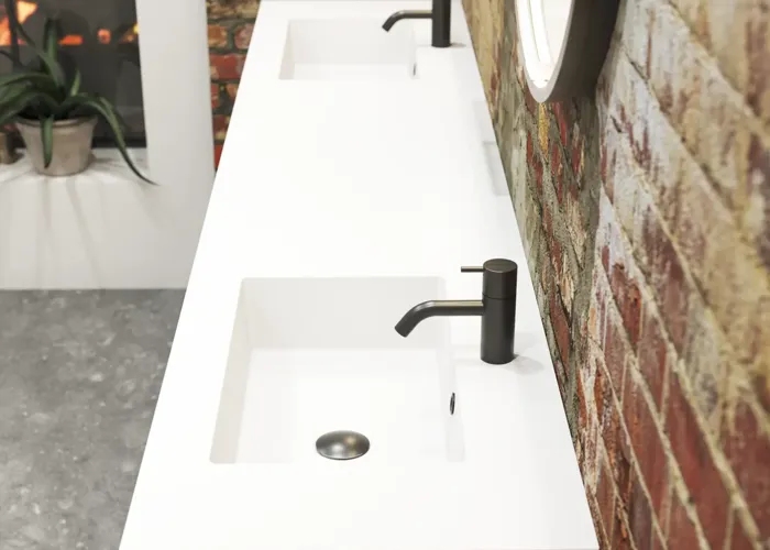 Raw and modern bathroom in an urban style. Beautiful vanity units and black framed round mirrors