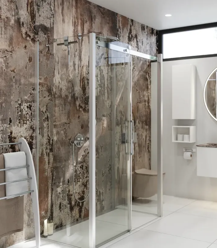 Bathroom inspiration with luxurious shower cubicle with sliding door, white bathroom furniture and a raw-look wall that gives the bathroom a raw and urban feel