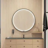 Stylish bathroom in Scandinavian and Japandi design with light wood walls, round mirror, and minimalist bathroom furniture