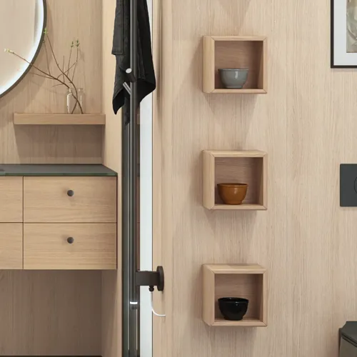 Stylish bathroom in Scandinavian and Japandi design with light wood walls, round mirror, and minimalist bathroom furniture