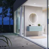 Lovely large bathroom with furniture in light, blue colors oozing with Nordic style