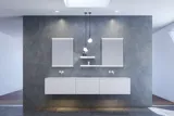 Large and modern minimalist bathroom inspiration with double sinks, square mirrors with light control, stylish pendant lights, large grey tiles, and a spacious design with plenty of natural light