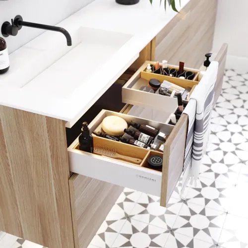 Nordic bathroom in wood finish with beautiful black framed round mirrors and plenty of storage in the furniture