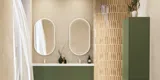 Large and luxurious bathroom with lovely oval mirrors and beautiful tiles in natural colours