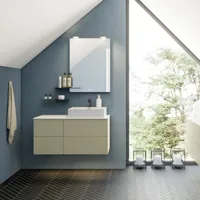 Bathroom with slanted ceiling inspiration, beige furniture with grooves, elegant countertop and square sink, beautiful mirror with shelves, blue walls, large windows, and black herringbone floor give a bright, urban look.