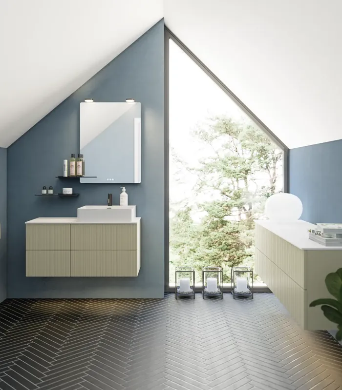Bathroom with slanted ceiling inspiration, beige furniture with grooves, elegant countertop and square sink, beautiful mirror with shelves, blue walls, large windows, and black herringbone floor give a bright, urban look.