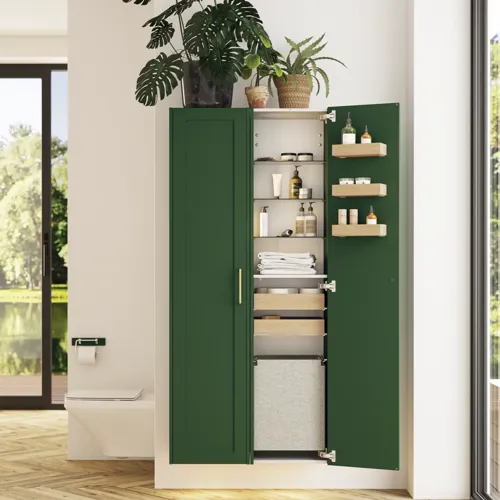 Large bathroom in green colors with vanity unit, brass framed oval mirror and beautiful framed doors