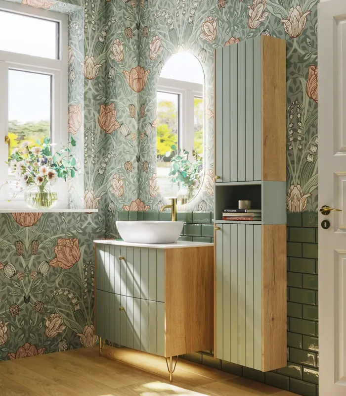 Bathroom inspiration with green special color bathroom furniture with natural oak sides, elegant grooves, stylish countertop with romantic oval countertop sink, beautiful oval mirror, combined with floral wallpaper gives a graceful, vintage retro look.