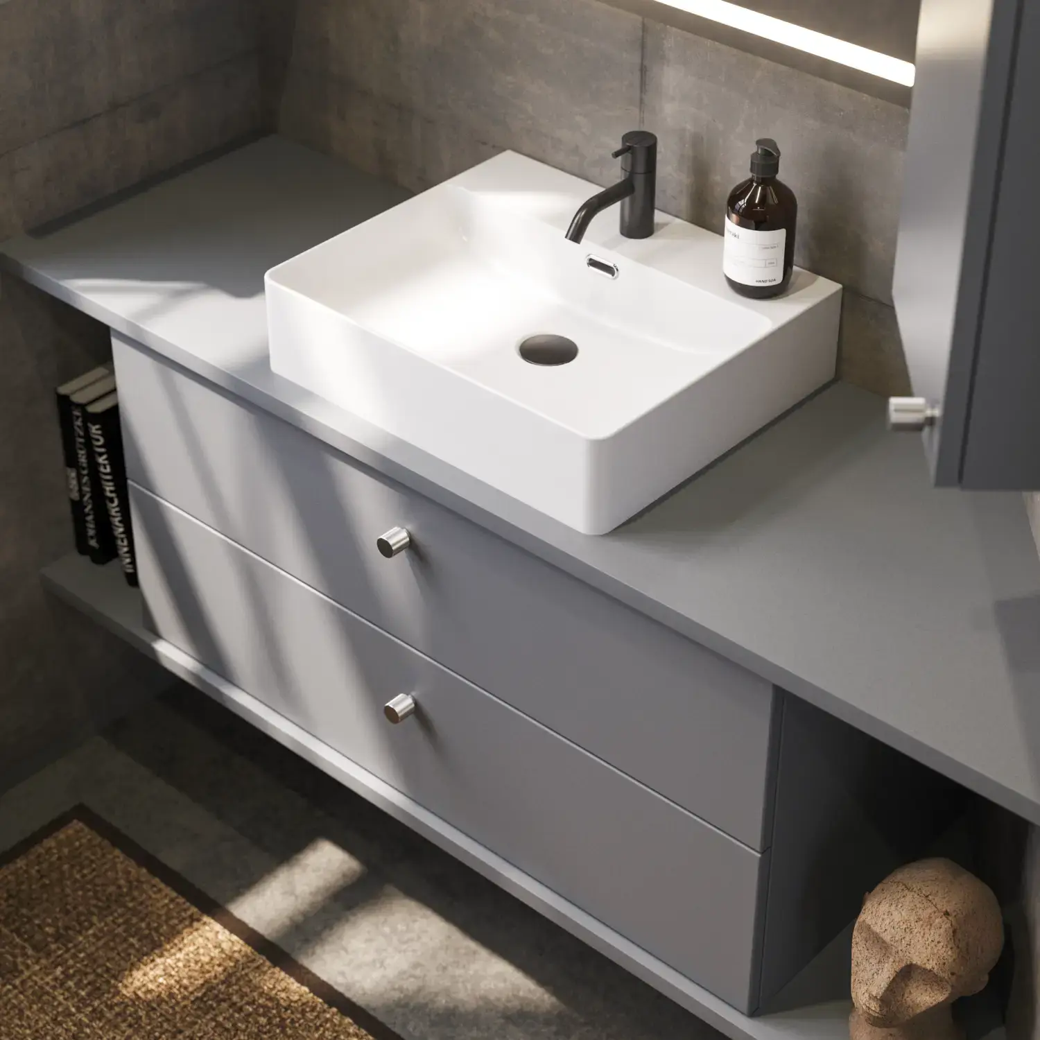 Bathroom inspiration with sloped walls inspiration, grey vanity unit and upper cabinet, custom-made countertops, modern square countertop basin, square mirror with lights, raw concrete walls and floors create an urban look