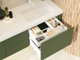 Large and luxurious bathroom with lovely oval mirrors and beautiful tiles in natural colours