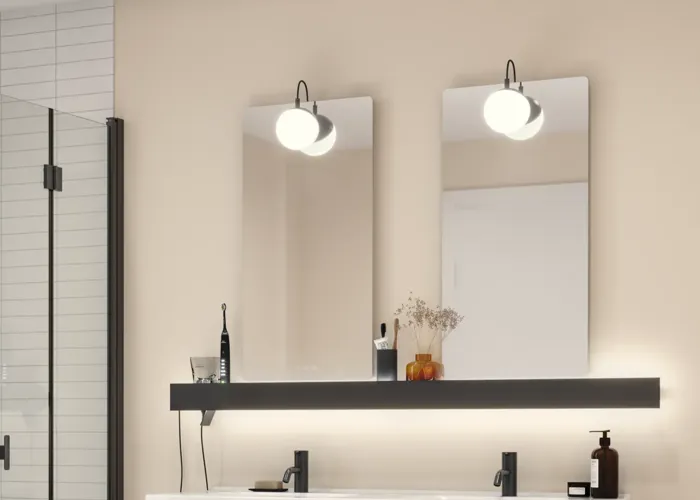 Large bathroom inspiration with brown oak furniture, black frame fronts, double sink, black shelf, rounded mirrors, black corner shower with folding doors, white tiles, and beige walls for a modern look