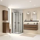 Large bathroom inspiration with brown oak furniture, black frame fronts, double sink, black shelf, rounded mirrors, black corner shower with folding doors, white tiles, and beige walls for a modern look