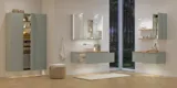 Large bathroom inspiration in Nordic style with bathroom furniture in light blue colour and wooden countertop with elegant countertop basin, herringbone wooden floor creating a bright and classic style