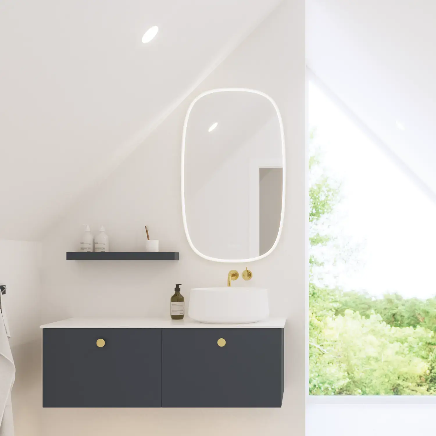 Elegant and modern bathroom inspiration with slanted ceiling, wall-mounted blue vanity unit and base cabinets, round sink with brass faucet, illuminated mirror, and natural light