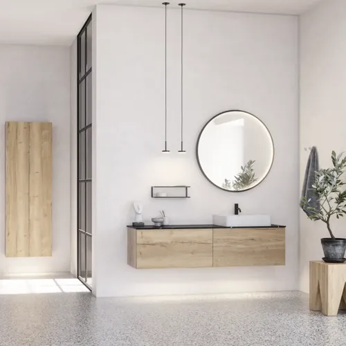 Large urban bathroom inspiration with natural oak furniture, stone countertop with square basin, round mirror with black frame, natural colors, and terracotta floor for an industrial and modern look