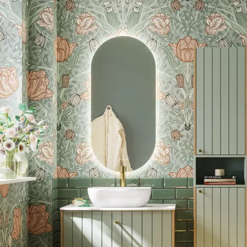 Bathroom inspiration with green special color bathroom furniture with natural oak sides, elegant grooves, stylish countertop with romantic oval countertop sink, beautiful oval mirror, combined with floral wallpaper gives a graceful, vintage retro look.