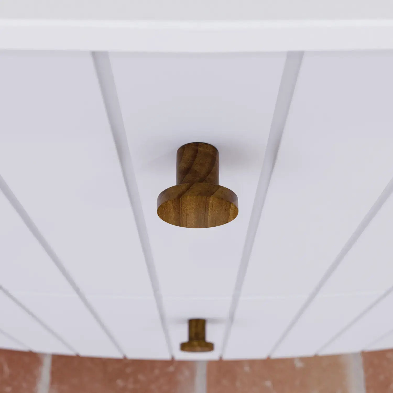 Large bathroom inspiration with white ribbed furniture, elegant countertops and countertop basins, oval mirrors with lights, exposed beams and patterned tiles create a vintage and stylish look