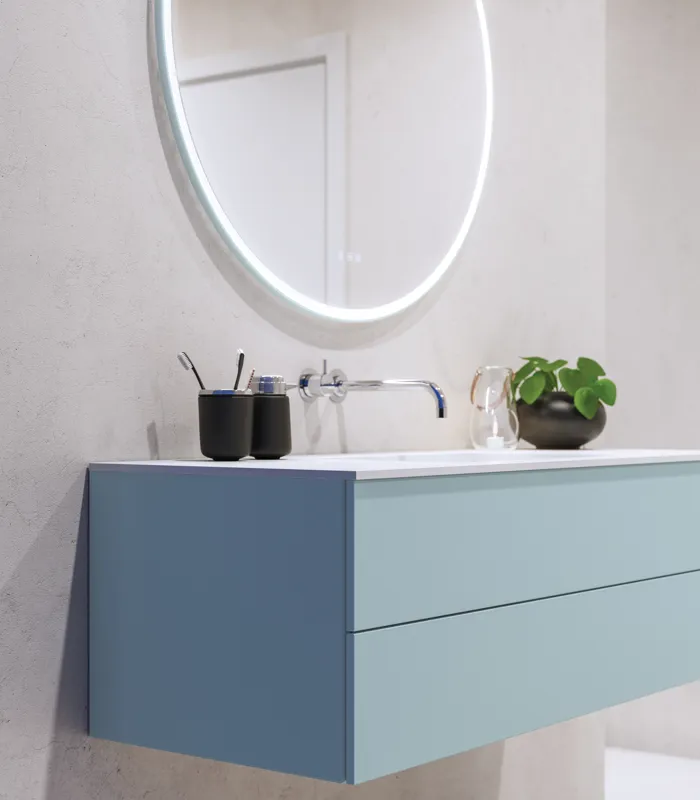 Lovely large bathroom with furniture in light, blue colors oozing with Nordic style