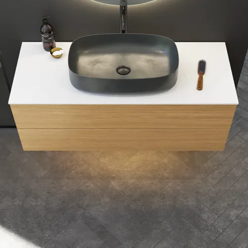 Minimalist and sleek bathroom inspiration with vanity unit, base cabinets, and tall cabinets in golden oak, large round mirror with light control, colored toilet, and countertop sink