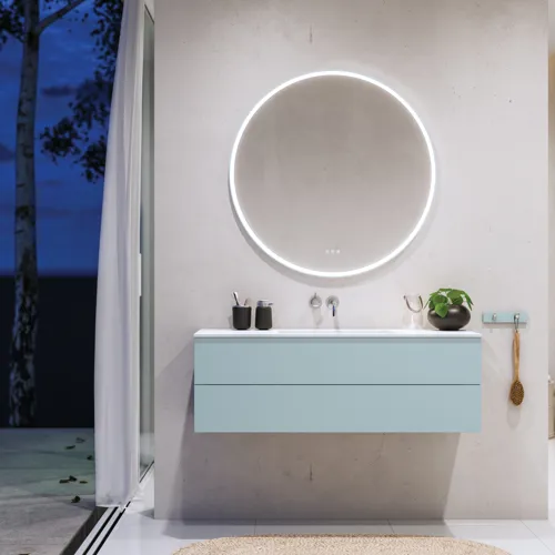Lovely large bathroom with furniture in light, blue colors oozing with Nordic style