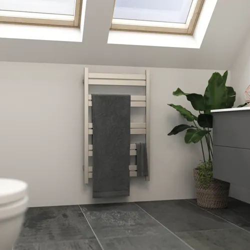 Bathroom with slanted walls inspiration featuring a stylish electric towel warmer that not only adds an aesthetic element to the bathroom but also leaves towels wonderfully warm.