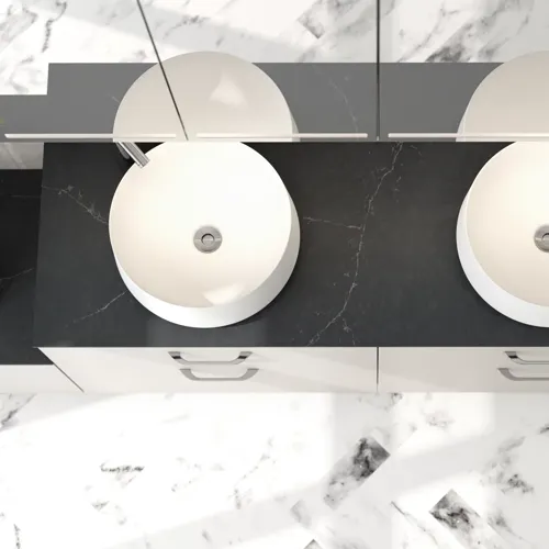 Romantic bathroom inspiration with mirror cabinet offering practical and graceful storage solutions, double countertop sinks on a stone countertop.