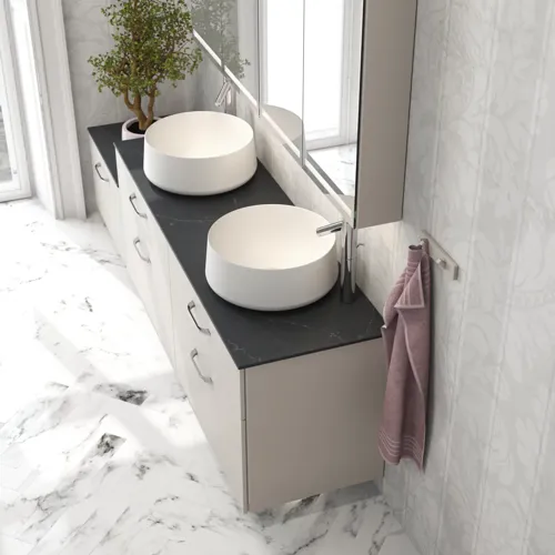 Romantic bathroom inspiration with mirror cabinet offering practical and graceful storage solutions, double countertop sinks on a stone countertop.