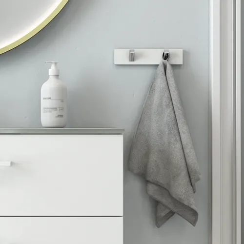 Large and romantic bathroom with brass framed round mirror