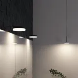 Bathroom inspiration with modern black lamps, highlighting the bathroom's minimalist and elegant style with dim lighting.