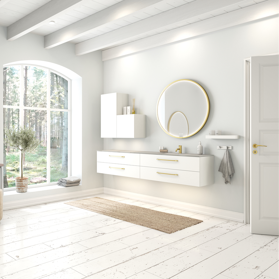 Large and romantic bathroom with brass framed round mirror