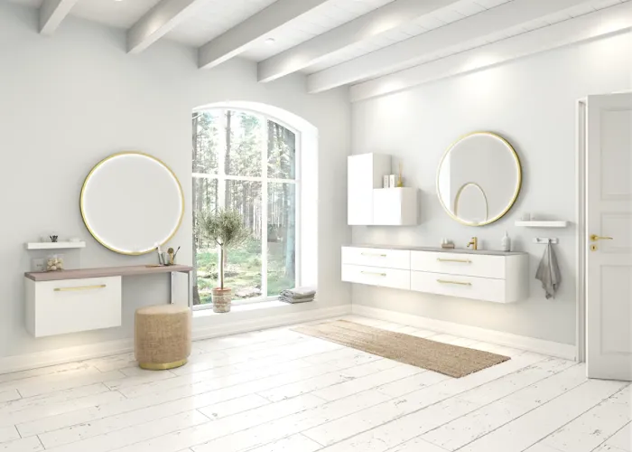 Large and romantic bathroom with brass framed round mirror