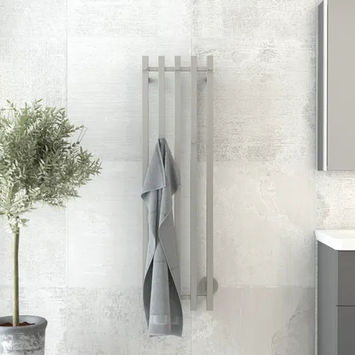 Bathroom inspiration with an electric towel warmer providing a practical solution for keeping your towels warm and dry, while adding a touch of elegance to your bathroom.
