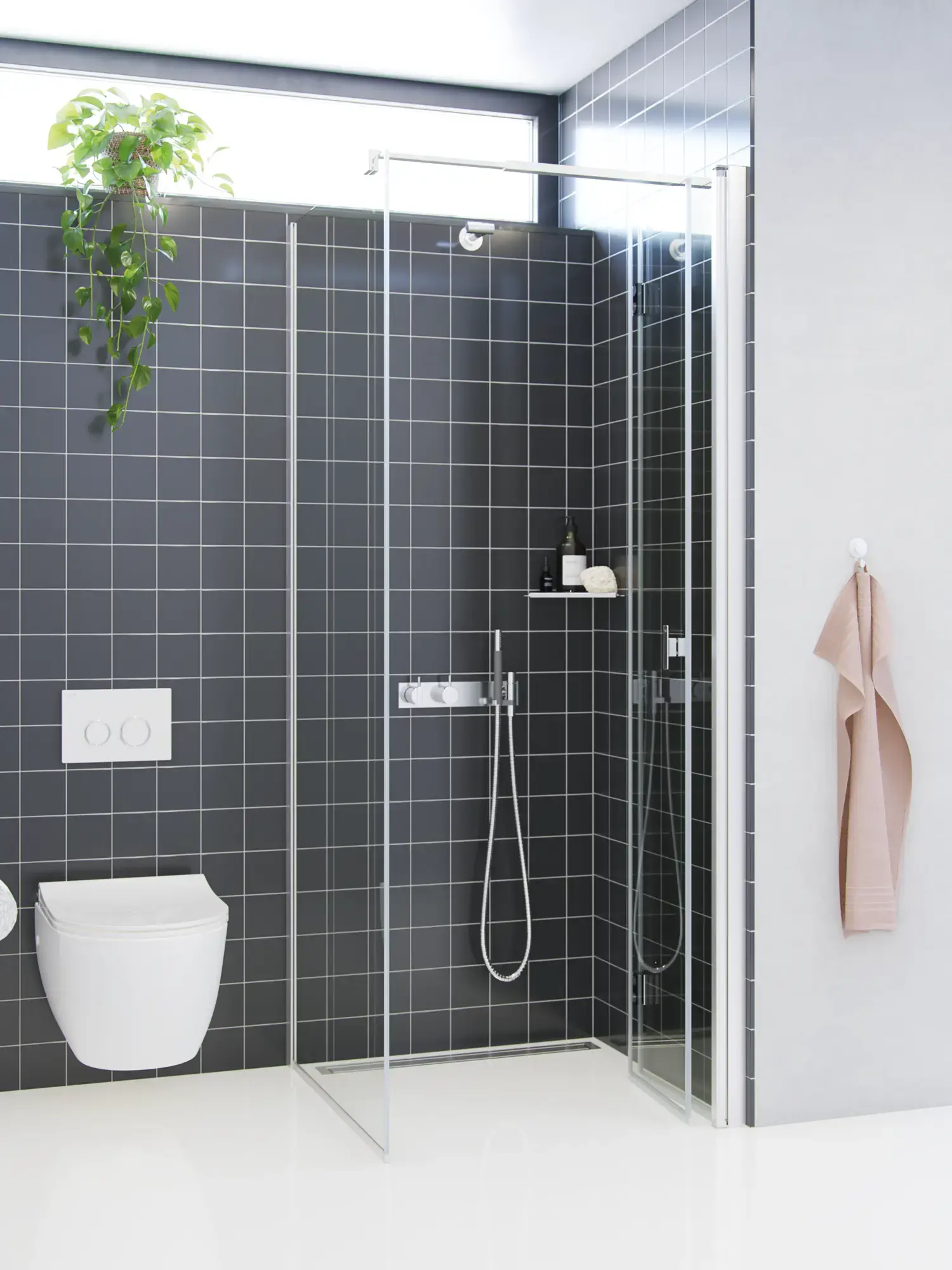 Bathroom inspiration with a shower screen with fixed wall and folding door in clear glass and satin that gives a bright and modern look.
