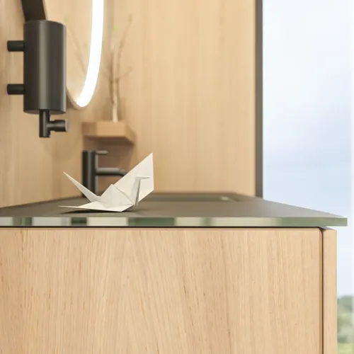 Stylish bathroom in Scandinavian and Japandi design with light wood walls, round mirror, and minimalist bathroom furniture.