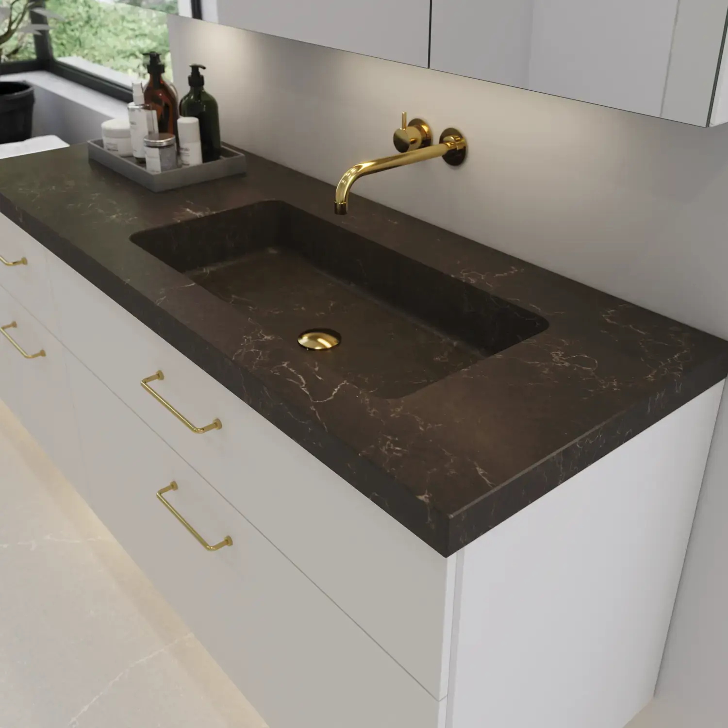 Large bathroom inspiration with elegant stone sink in Calypso with stylish white vanity unit with brass handles and beautiful mirror cabinet with stone floor for an exclusive and modern look.