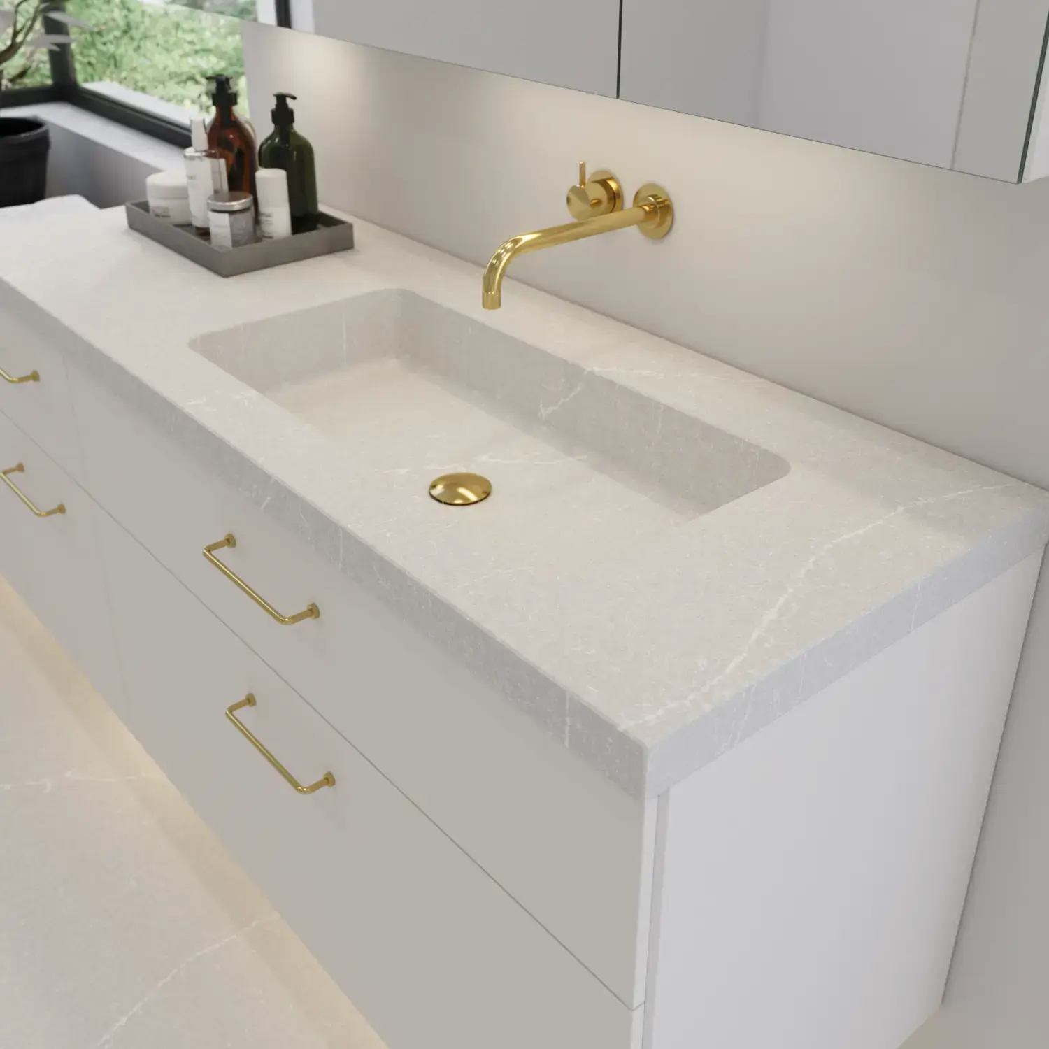 Large bathroom inspiration with elegant stone sink in Desert Silver with stylish white vanity unit with brass handles and beautiful mirror cabinet with matching stone floor for an exclusive and modern look.