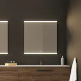 Large bathroom inspiration with vanity units and brown oak slats, freestanding bathtub, and square mirrors with light, elegant double sink gives a modern and symmetrical look