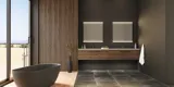 Large bathroom inspiration with vanity units and brown oak slats, freestanding bathtub, and square mirrors with light, elegant double sink gives a modern and symmetrical look