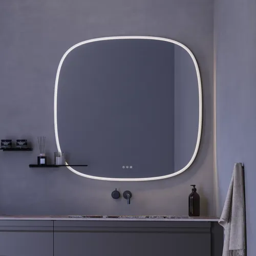 Large bathroom inspiration with grey vanity unit with integrated handle, stylish side-mounted sink, square mirror with rounded corners, concrete-look walls and raw materials for an urban look