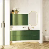 Large bathroom in green colors with vanity unit, brass framed oval mirror and beautiful framed doors